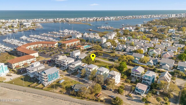 birds eye view of property featuring a water view