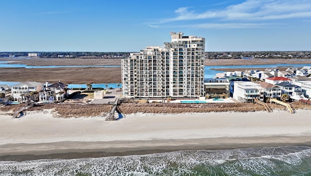 bird's eye view featuring a beach view and a water view