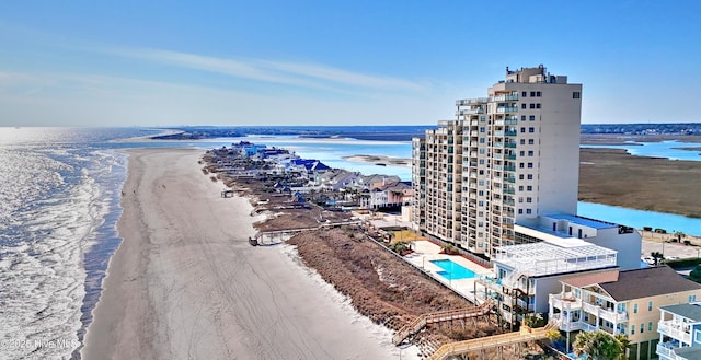 aerial view featuring a water view and a view of the beach