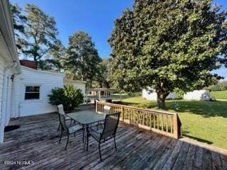 wooden deck with a yard