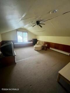 additional living space featuring lofted ceiling, ceiling fan, and carpet flooring