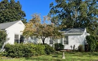 exterior space with a front yard