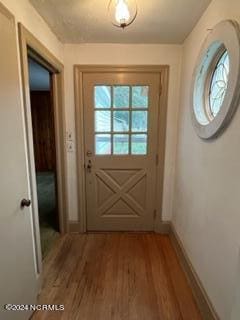 doorway featuring hardwood / wood-style floors