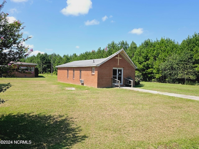 exterior space with a front lawn