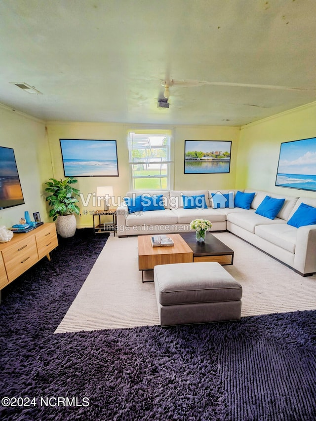 carpeted living room featuring ceiling fan