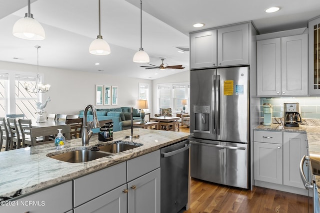 kitchen featuring pendant lighting, appliances with stainless steel finishes, plenty of natural light, and sink