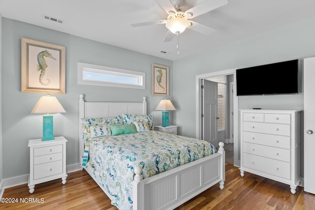 bedroom with ceiling fan and hardwood / wood-style floors