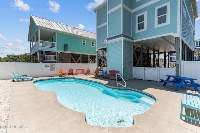 view of swimming pool featuring a patio