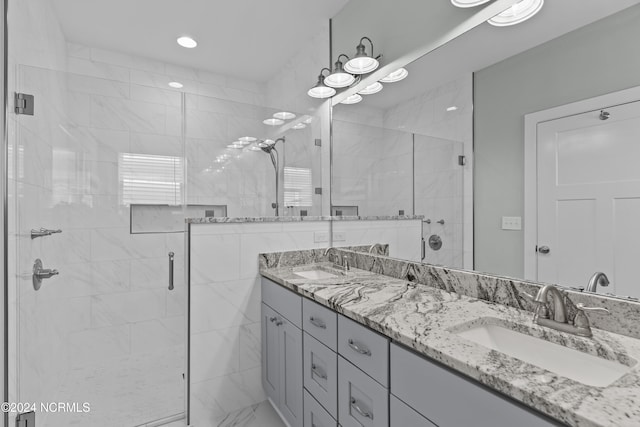 bathroom with vanity and an enclosed shower