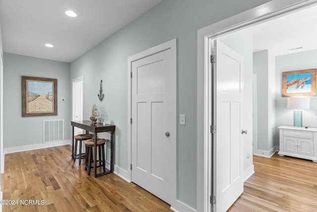 corridor featuring light hardwood / wood-style floors