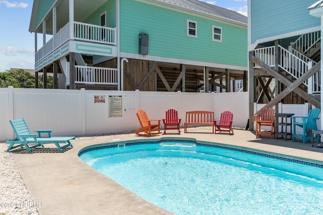 view of pool featuring a patio