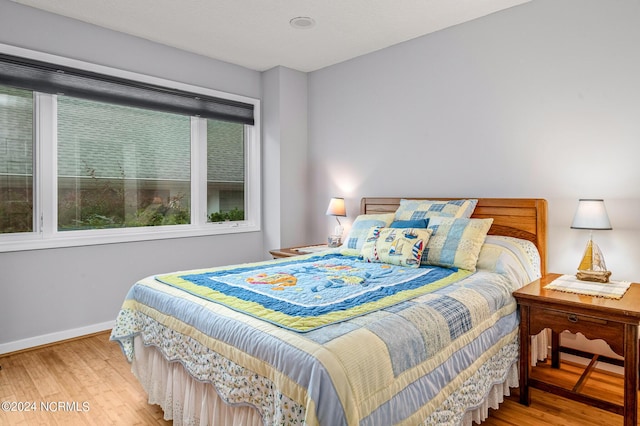 bedroom featuring hardwood / wood-style flooring