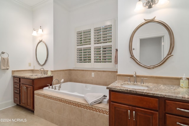 bathroom with tile patterned floors, tiled tub, vanity, and ornamental molding