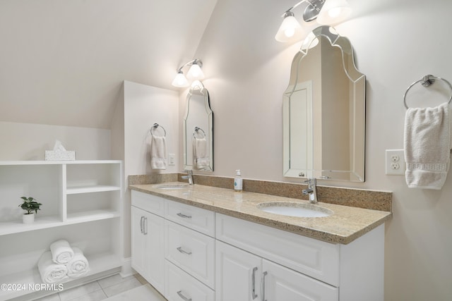 bathroom with vanity and vaulted ceiling