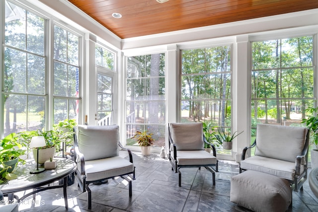 sunroom / solarium featuring wood ceiling