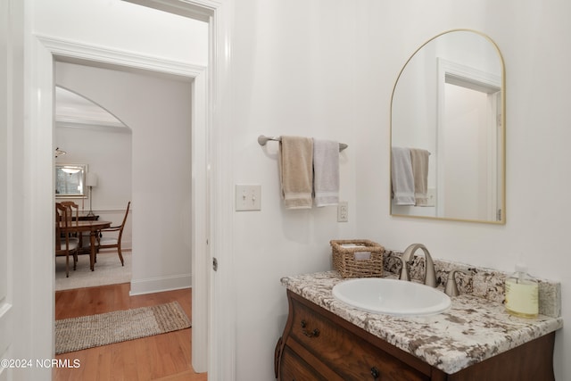 bathroom featuring vanity and hardwood / wood-style flooring