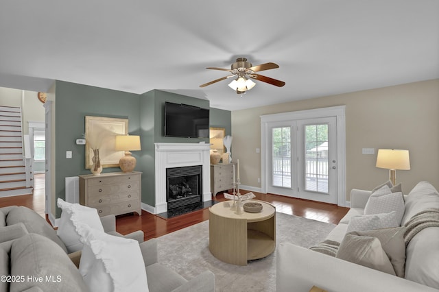 204 Van Riggs Rd, Hubert, NC 28539 - living area featuring ceiling fan, plenty of natural light, a fireplace with flush hearth, and stairs