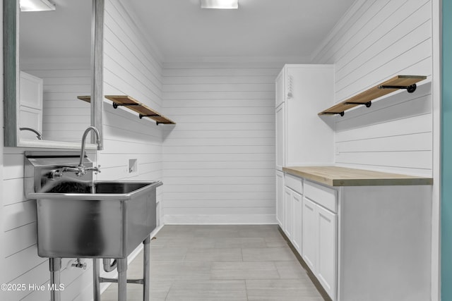 204 Van Riggs Rd, Hubert, NC 28539 - laundry area featuring ornamental molding and wood walls
