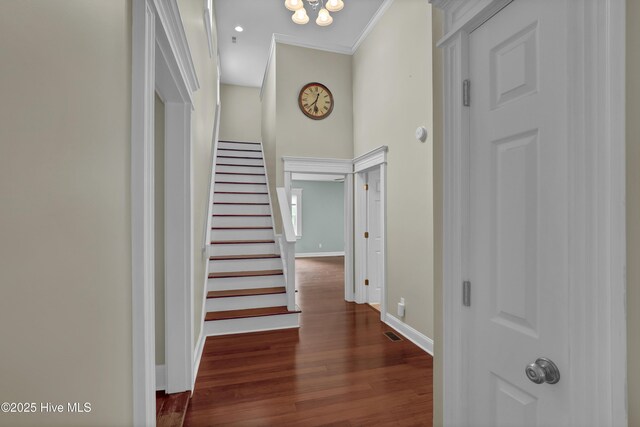 204 Van Riggs Rd, Hubert, NC 28539 - corridor featuring crown molding, dark wood-style flooring, stairway, and a high ceiling