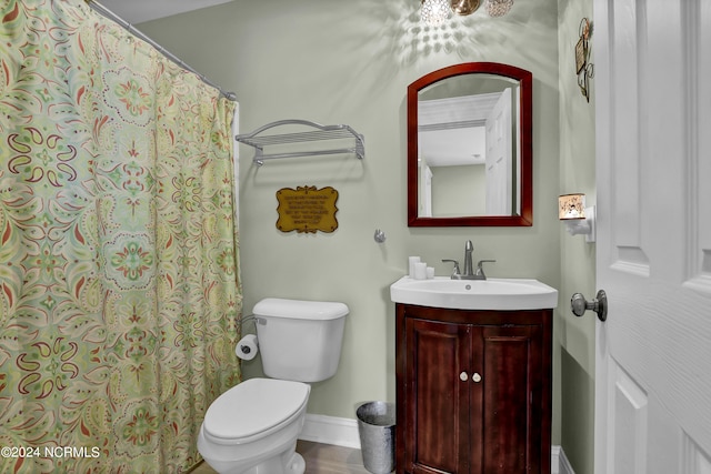 bathroom with a shower with shower curtain, wood-type flooring, vanity, and toilet