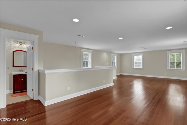 204 Van Riggs Rd, Hubert, NC 28539 - spare room with dark wood finished floors and recessed lighting