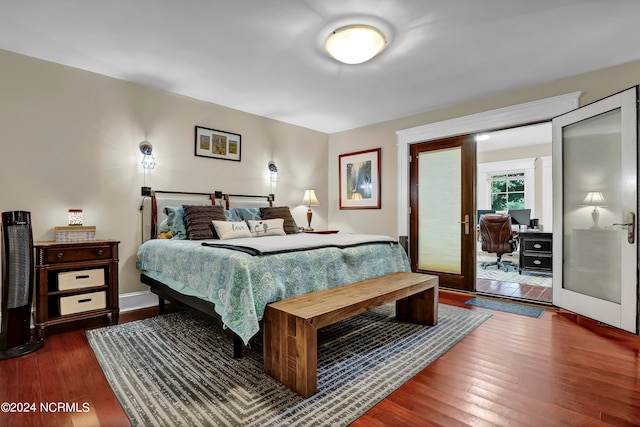 bedroom with french doors and dark wood-type flooring