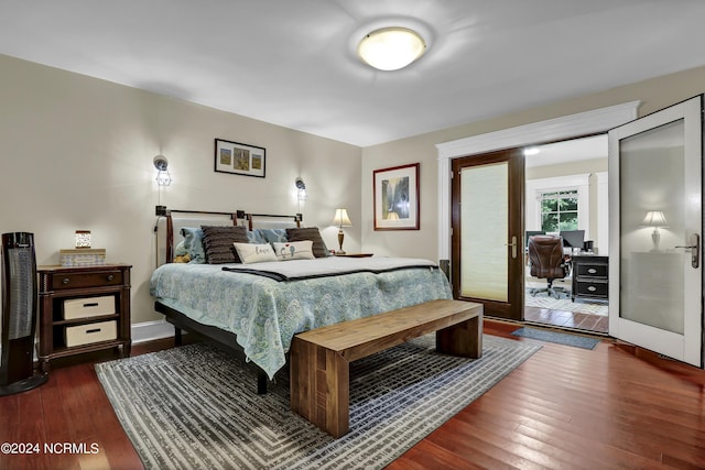 bedroom featuring dark wood finished floors