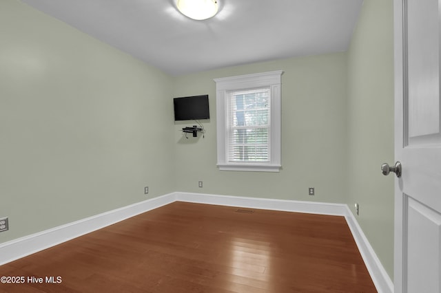 204 Van Riggs Rd, Hubert, NC 28539 - spare room with dark wood finished floors and baseboards