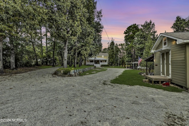 yard at dusk with driveway