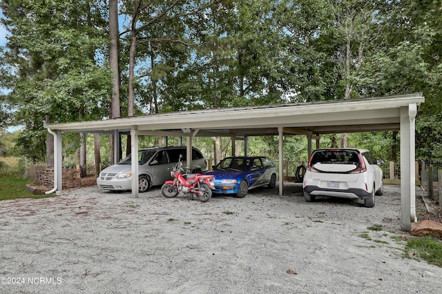 view of vehicle parking featuring a carport