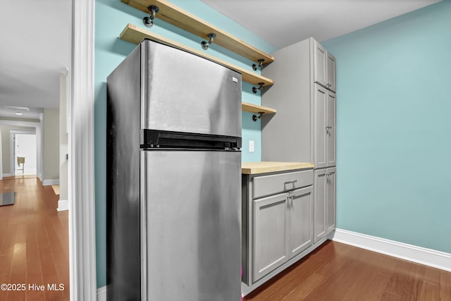 204 Van Riggs Rd, Hubert, NC 28539 - kitchen with freestanding refrigerator, dark wood-type flooring, and open shelves