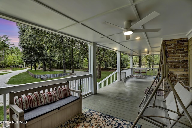 deck featuring a porch and ceiling fan