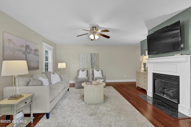 204 Van Riggs Rd, Hubert, NC 28539 - living room featuring wood finished floors, a ceiling fan, and a fireplace with flush hearth