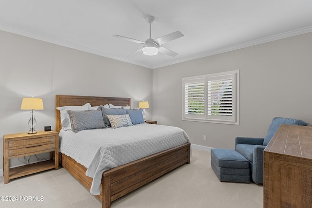 carpeted bedroom featuring crown molding and ceiling fan