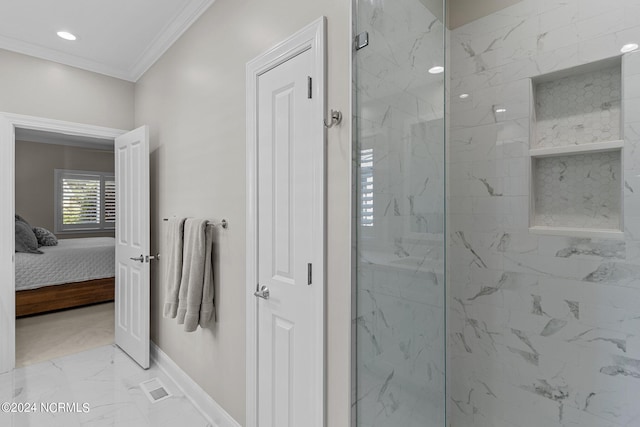 bathroom featuring ornamental molding and tiled shower