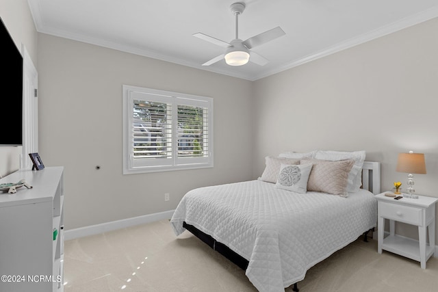 bedroom with ornamental molding, light carpet, and ceiling fan