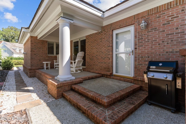 view of patio / terrace featuring a grill and covered porch