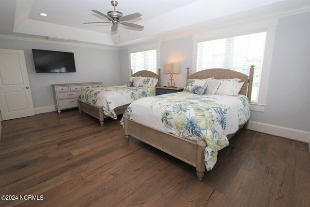 living area featuring a water view, plenty of natural light, lofted ceiling, and dark wood-type flooring