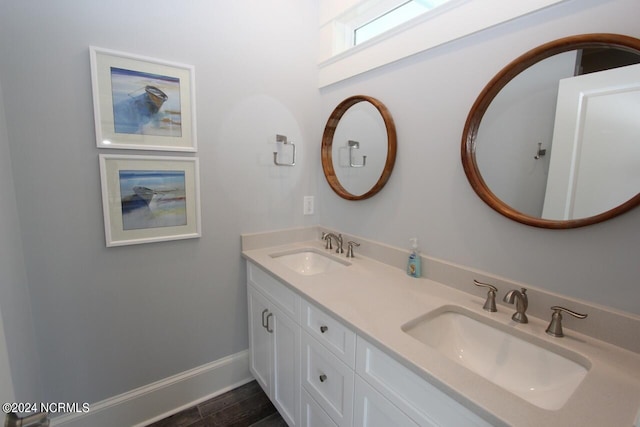 bathroom with hardwood / wood-style flooring and vanity