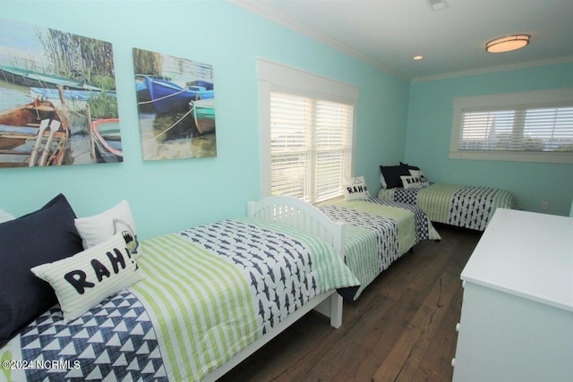 bedroom with crown molding, dark hardwood / wood-style flooring, and multiple windows