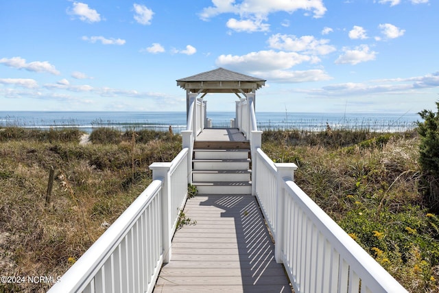 view of property's community featuring a gazebo and a water view