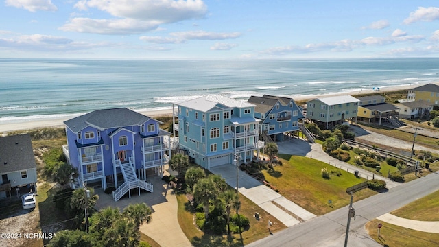 bird's eye view with a view of the beach and a water view