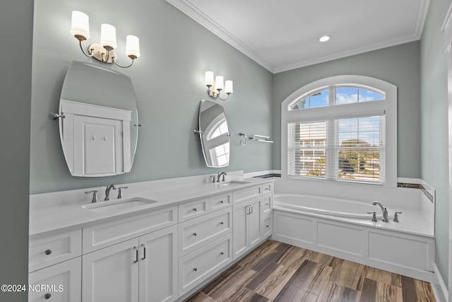 bathroom with crown molding, a tub, vanity, and hardwood / wood-style flooring