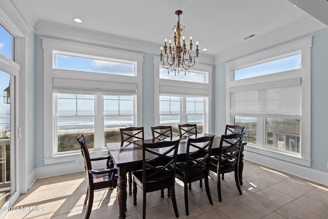 kitchen with light stone counters, hanging light fixtures, stainless steel appliances, and white cabinets