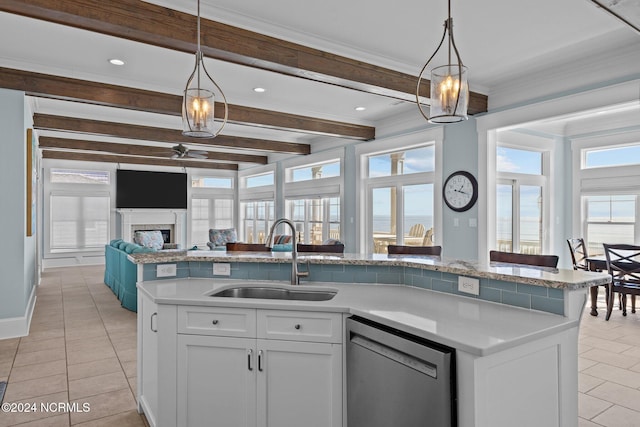 kitchen with white cabinets, dishwasher, sink, and a wealth of natural light