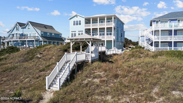 drone / aerial view featuring a water view and a beach view