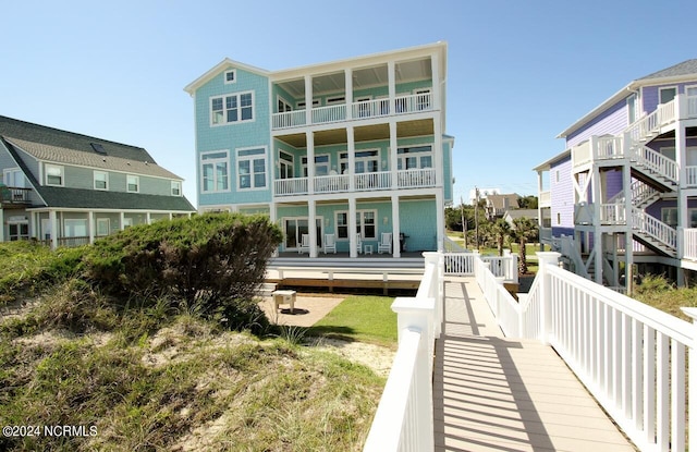 back of property with a balcony