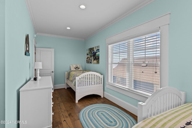 bedroom featuring crown molding and dark hardwood / wood-style flooring