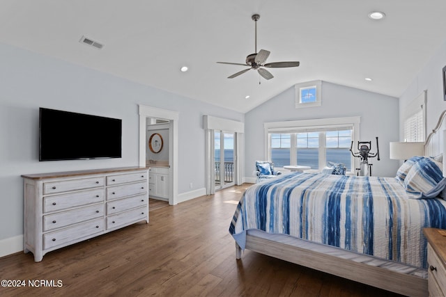 bedroom featuring ceiling fan, lofted ceiling, connected bathroom, hardwood / wood-style flooring, and a water view