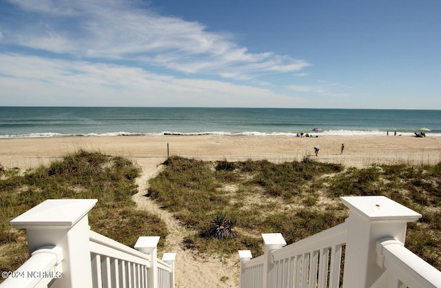 view of water feature with a beach view